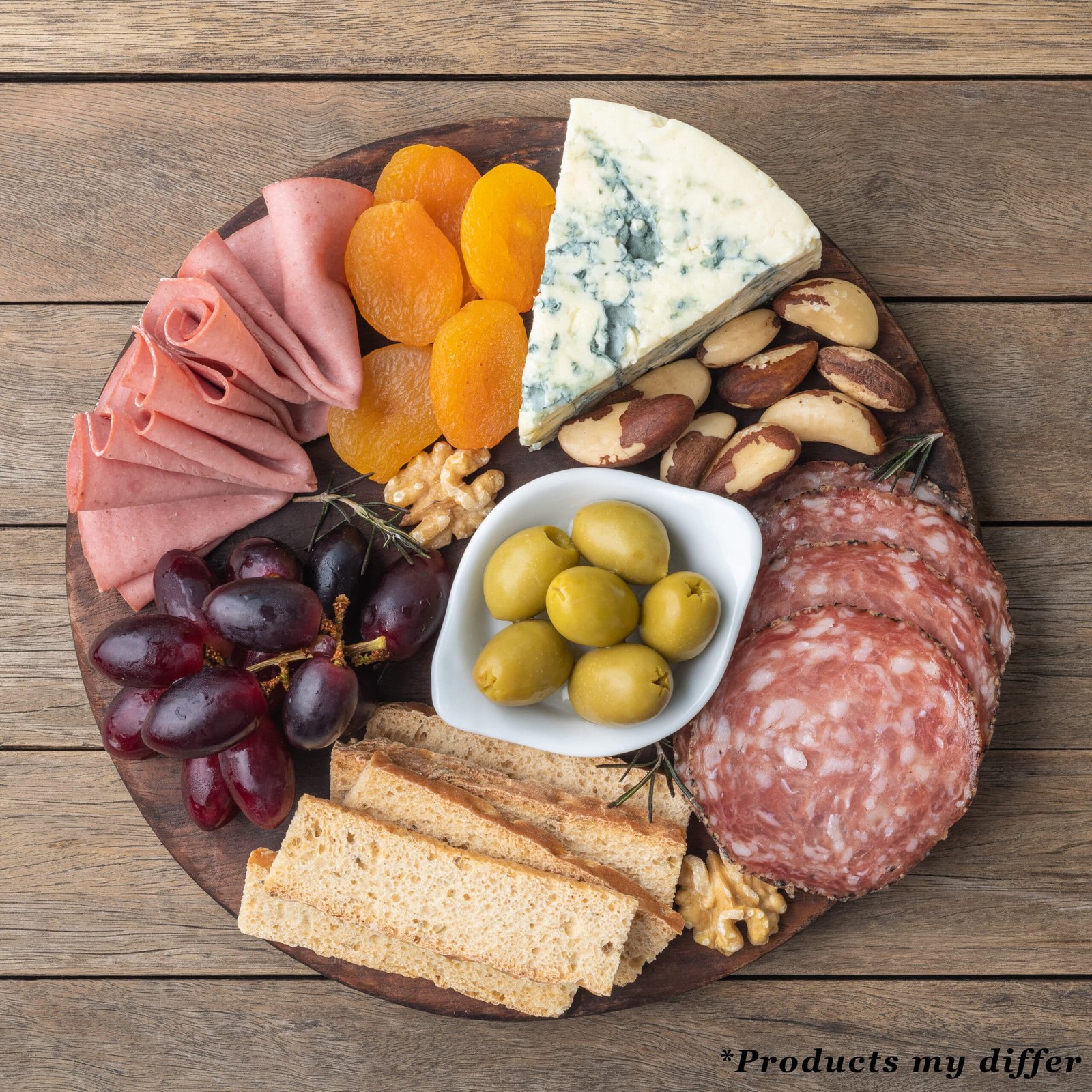 Appetizer board with cheese, nuts, fruits, toasts and charcuteri